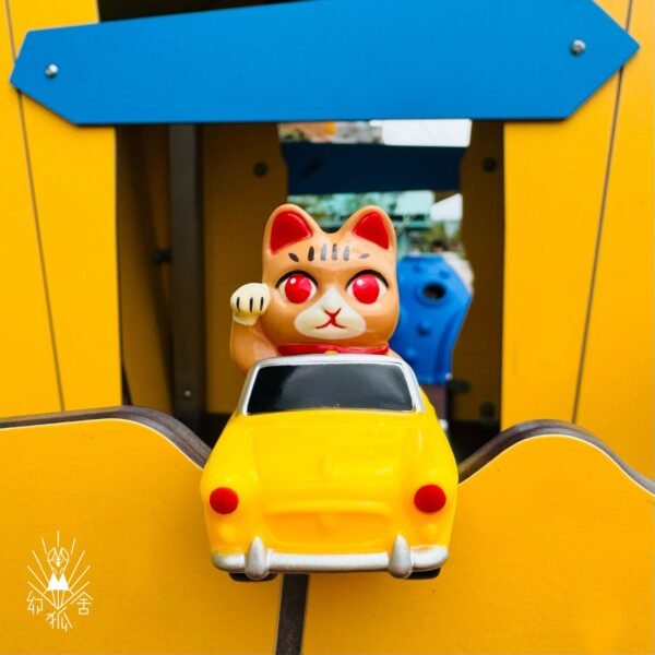 Tabby cat yellow car
